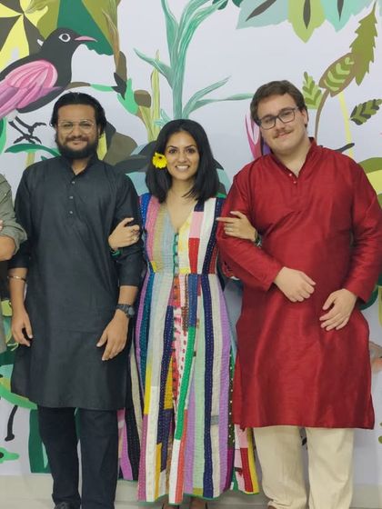 The team with a representative from the Alliance Française, celebrating the completion of 'The Promised Land' mural.