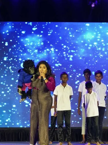 Leading a group of kids in a fun activity on stage. My shows are not just about watching; they are about participating and being part of the fun.