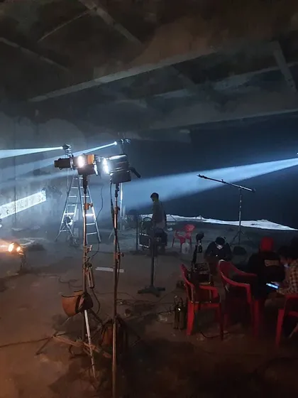 We create dramatic shafts of light using a combination of specialized equipment. This setup uses a K5600 Jokerbug 800 with a Bug-A-Beam adapter on an ETC Source Four, blending HMI and bi-color LED sources to achieve a highly controlled, cinematic look for a promo shoot.