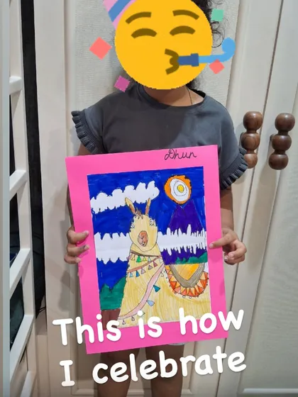 The pride on a student's face when they hold up a finished masterpiece is priceless. This student is celebrating their completed llama drawing, a project they started from a blank page and finished with their own creative choices.