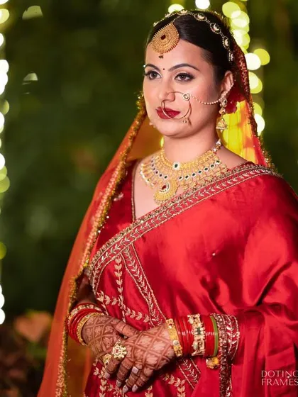A fusion look for a Maharashtrian bride at her North Indian wedding. The makeup combines traditional elements with a modern touch, creating a unique and stunning look.