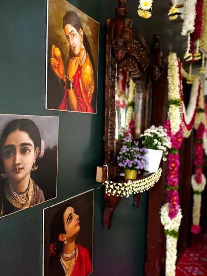 Details from a Pellikuthuru ceremony, where we used classic Raja Ravi Varma paintings and traditional wooden furniture to create an authentic, artistic, and heritage-filled atmosphere.