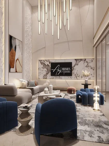 For this double-height family lounge, I used scale to create a sense of grandeur. The statement chandelier draws the eye upward, while the custom wall paneling adds texture. The deep blue sofas provide a pop of color, creating a space that is both cozy and chic.