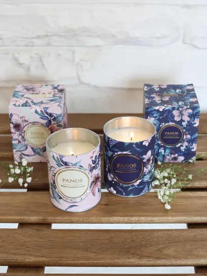 A pair of our floral scented candles, one in pink and one in blue, with their matching gift boxes. They are perfectly packaged for gifting or for adding a touch of charm to your home.