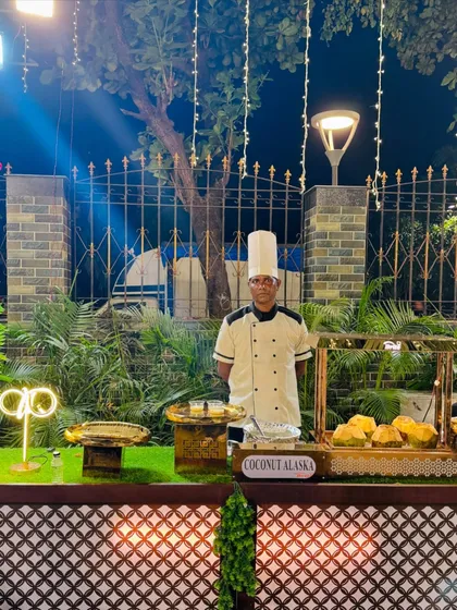 My chef at the Coconut Alaska station, a unique dessert featuring tender coconut and ice cream.