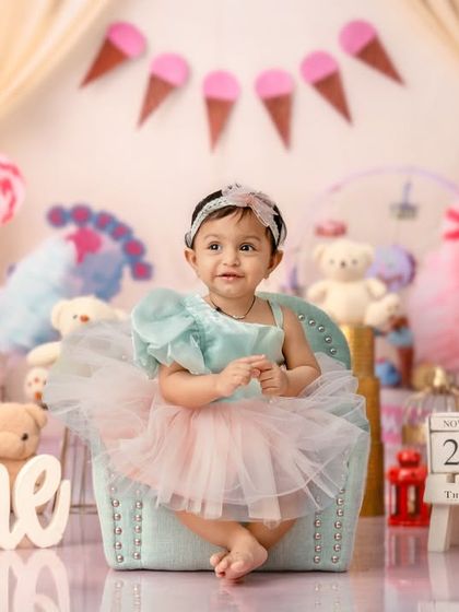 Welcome to Candyland. A sweet first birthday theme with ice cream cones, lollipops, and pastel colors.