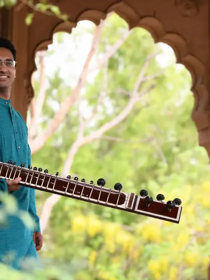 A portrait with my Sitar, taken in Vrindavan. The instrument is more than just wood and strings; it is a lifelong companion and the medium through which I express my dedication to music.