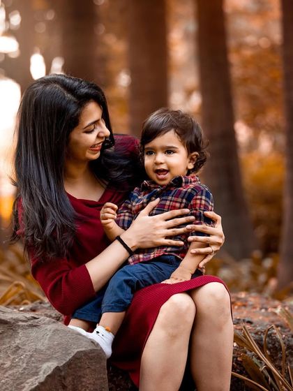 A quiet moment between mother and son during their outdoor family session. The beautiful autumn colors and soft light create a warm and intimate feel for this beautiful portrait.