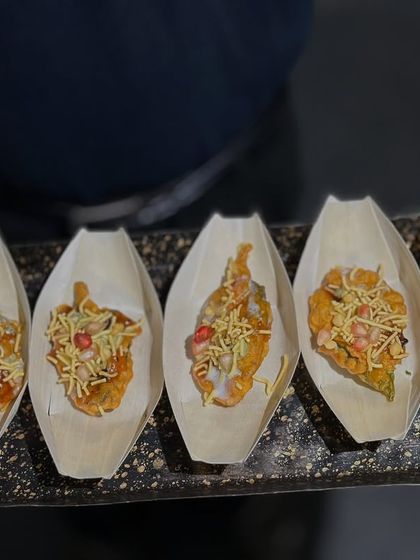 Our Palak Patta Chaat is a crispy, tangy, and flavorful delight. Each leaf is fried to perfection and topped with yogurt, chutneys, and sev.