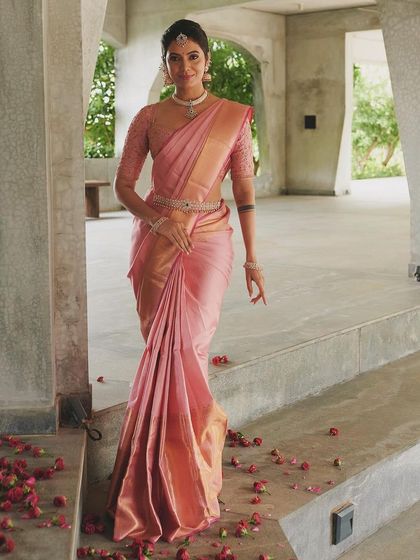 Celebrating National Handloom Day in a beautiful pink Kanchivaram. I paired it with a custom blouse featuring delicate embroidery on sheer sleeves.