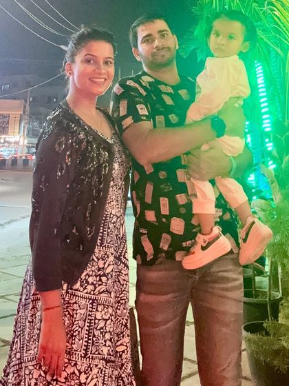 Another family photo, capturing a happy moment out and about.