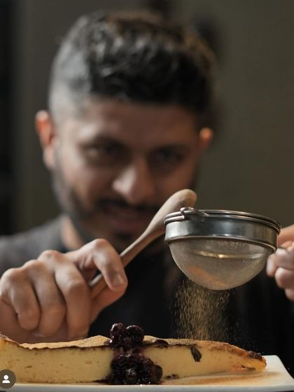 Basque-ing in the glory. I'm adding the final touches to this slice of creamy, burnt Basque cheesecake.