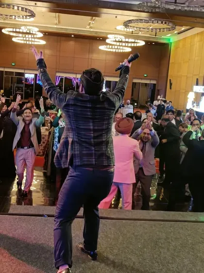 On stage at the Hyatt Regency in Chandigarh, getting the party started for a special anniversary event. I love commanding the stage and making sure the energy in the room is always at its peak.