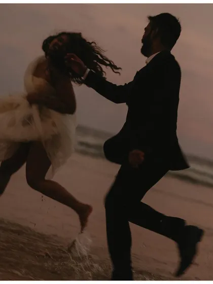 Running along the shoreline as the sun goes down. I love capturing this playful, carefree energy, where the couple can just be themselves and enjoy the moment.