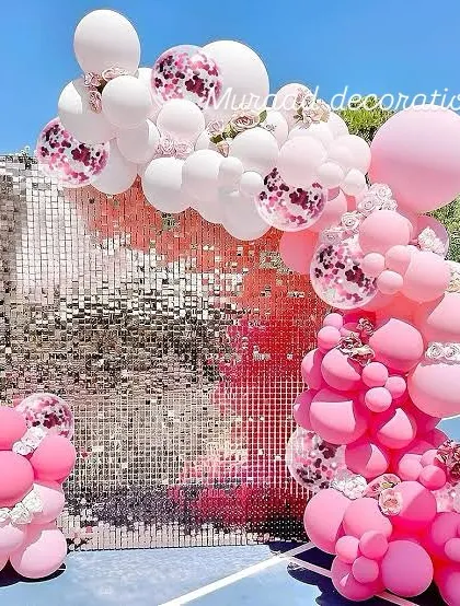 To add a touch of glamour to any party, I use shimmering sequin walls like this one. Paired with a balloon garland in shades of pink and confetti-filled accents, it creates a fun and dazzling photo backdrop that's perfect for birthdays and bachelorette parties.