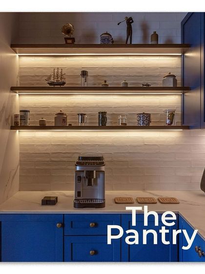 The office pantry, highlighted in Elle Decor. I chose a bold blue for the cabinetry to add a pop of color, while the under-shelf lighting provides both functional task lighting and a beautiful ambient glow on the curated decor.