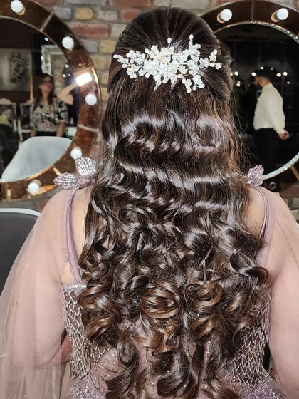 Another view of this beautiful curly hairstyle. I make sure every curl is perfectly defined and glossy, creating a look that is full of movement and life.