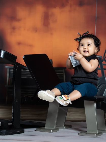 This little girl proves that the gym isn't just for boys. She's looking adorable and strong in our gym setup.