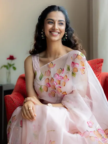 A duplicate of image 1, this is a beautiful example of soft, romantic styling with a hand-painted floral organza saree, perfect for creating a dreamy and elegant mood.