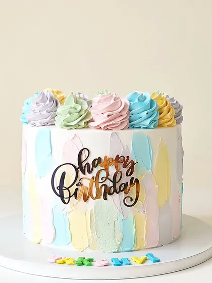 A cheerful cake with a pastel rainbow palette-knife texture. Topped with colorful buttercream swirls, this design is bright, modern, and completely fondant-free.