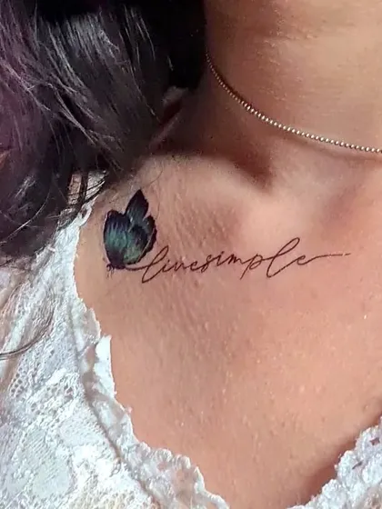 A delicate and beautiful "Live Simple" temporary tattoo with a butterfly. These are perfect for adding a personal touch to your look for a special occasion.