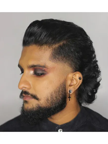 Another angle of this goth-inspired mullet and makeup collaboration. It shows how a great haircut can be the foundation for a unique and expressive style.