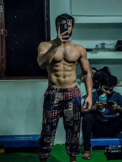 A closer look at the incredible results of a client who transformed his body naturally. Notice the defined abs and muscularity achieved through dedication.