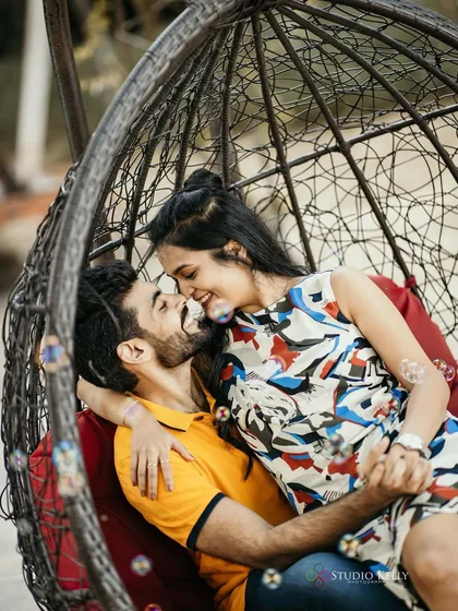 Bubbles add a touch of whimsy to this romantic shot. The makeup is light and pretty, enhancing her natural charm.