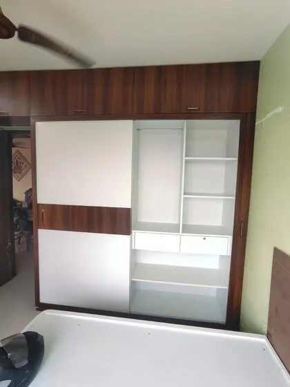 The internal view of a sliding wardrobe, showing a mix of shelving and drawer space. I customize these layouts based on whether you need more hanging space, folded storage, or drawers.