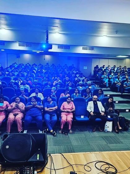 Another view of the audience at Narayana Health, captivated by the performance.