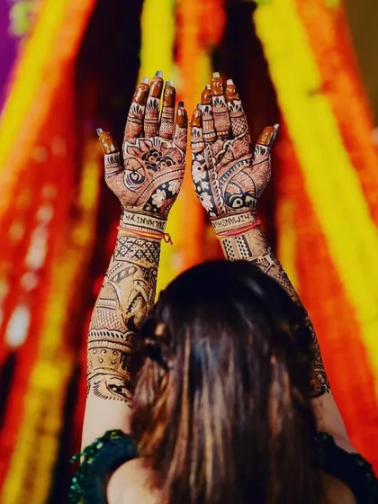 The joy of a bride seeing her story told through mehndi. This photo captures the happiness and excitement that is a part of every wedding we are fortunate to be a part of.