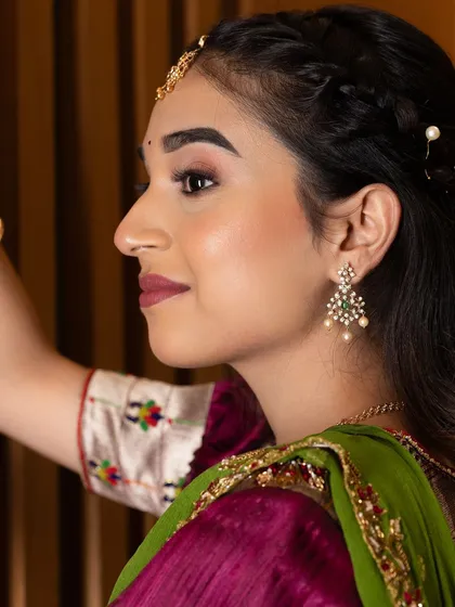 A profile view from a professional shoot, highlighting the defined brows and subtle contour that give structure to the face.