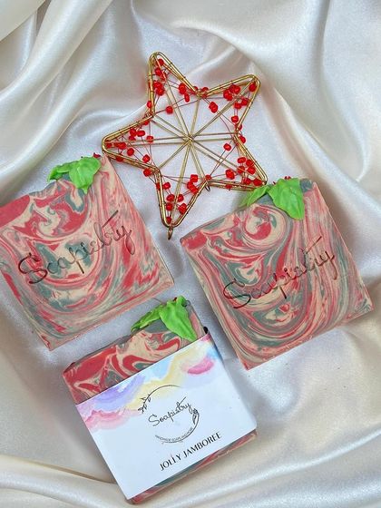 The Jolly Jamboree soap, with its festive red and green swirls and a little soap leaf on top.