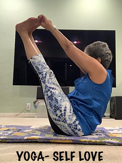 Practicing Navasana at home. You can build incredible core strength anywhere with the right guidance, which I provide in my online classes.