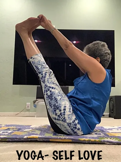 Practicing Navasana at home. You can build incredible core strength anywhere with the right guidance, which I provide in my online classes.