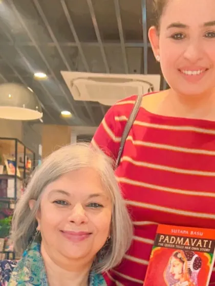 A member posing with author Sutapa Basu and her book "Padmavati." Our session with her was a deep dive into historical facts and captivating storytelling.