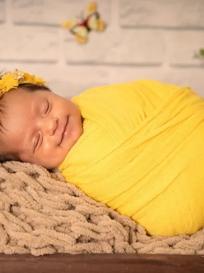 That sleepy newborn smile is pure magic. Capturing these fleeting expressions is one of the most rewarding parts of my job, giving you a memory of their earliest, sweetest dreams.