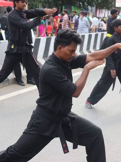 Students practicing a low stance during the "Happy Streets" public event. We enjoy showcasing the discipline and beauty of Kung Fu to the community.