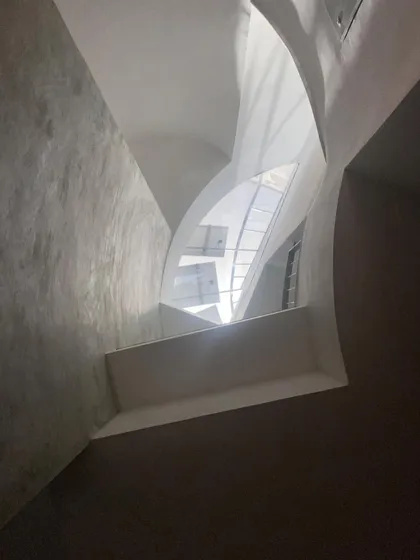 I believe light is a building material. This sculptural skylight in the People Tree House is designed with a unique geometry and volume that goes beyond a simple window. It is oriented to capture and sculpt the sunlight, creating a dynamic and ever-changing atmosphere within the home.