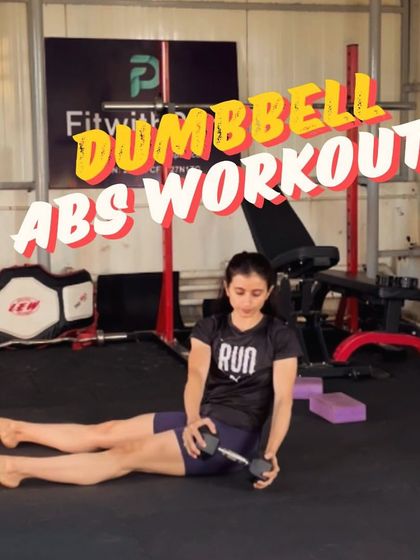 A title card for a dumbbell abs workout. This image shows a seated Russian twist, a great exercise for targeting the obliques.