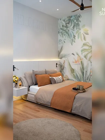 This view of the eco-chic bedroom highlights the interplay of the botanical wallpaper and the clean lines of the floating bed and side table. The design creates a spacious, uncluttered feel, perfect for a restful night's sleep.