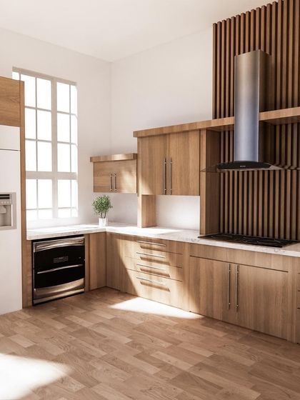 A seamless kitchen can also feel warm and natural. This design uses light wood for all the cabinetry, with integrated handles and appliances to create an uninterrupted and cohesive appearance.