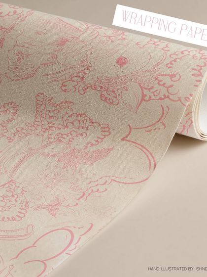 The 'Tea Among the Trees' design looks beautiful as wrapping paper, adding a touch of enchantment to any gift. The delicate line work prints wonderfully on kraft paper for a rustic, charming feel.