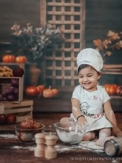Look at that smile. Our 'Little Chef' themed shoot is filled with giggles and playful moments. I love creating these imaginative setups where kids can just be kids.