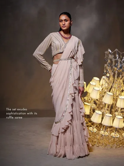 A full-length view of the Elsa Saree Set, emphasizing the cascading ruffles of the saree that create a sophisticated and modern silhouette.