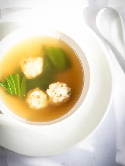 A light and clear Asian-style broth with chicken or fish balls. This dish is all about clean flavors and delicate balance.
