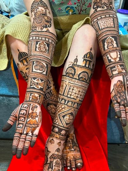 This photo shows a full set of story-telling mehndi, with different scenes and figures on the hands, arms, and legs, creating a complete work of art.