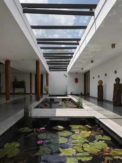 We feature spaces that bring the outdoors in. This home in Kottayam by Thomas Parambil Architects dissolves the boundaries between interior and landscape with a serene, sky-lit water court filled with lilies, creating a tranquil heart for the home.
