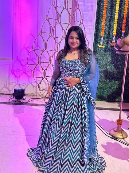 The vibrant colours and modern pattern of this lehenga make it a standout piece. It’s a comfortable and stylish rental for a sangeet or daytime wedding event.