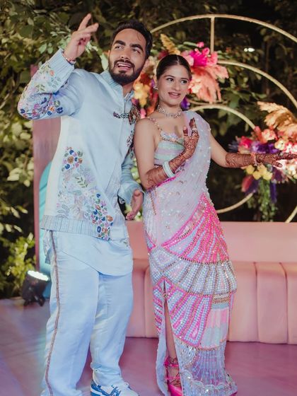 A fun and candid shot of the couple dancing.